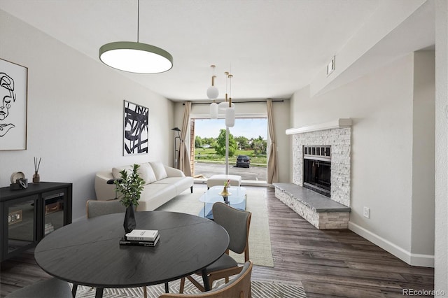 4273 S Salida Way Unit 1, Aurora, CO 80013 - living room with wood finished floors, a fireplace, and baseboards