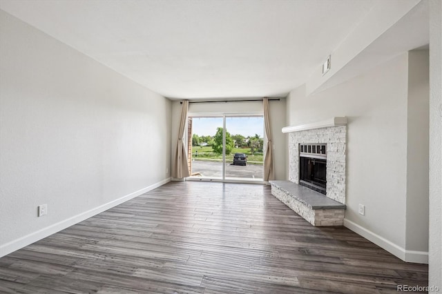 4273 S Salida Way Unit 1, Aurora, CO 80013 - unfurnished living room featuring baseboards, wood finished floors, and a fireplace