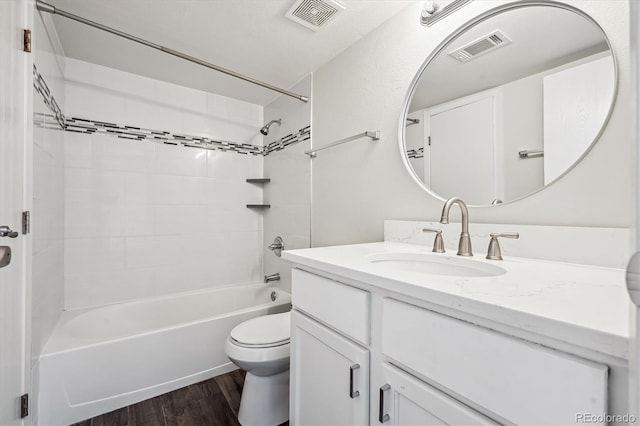 4273 S Salida Way Unit 1, Aurora, CO 80013 - bathroom with vanity, bathtub / shower combination, toilet, and wood finished floors