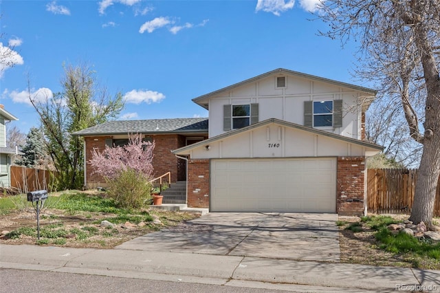 7140 S Reed Ct, Littleton, CO 80128 - view of front of property with brick siding, driveway, and an attached garage