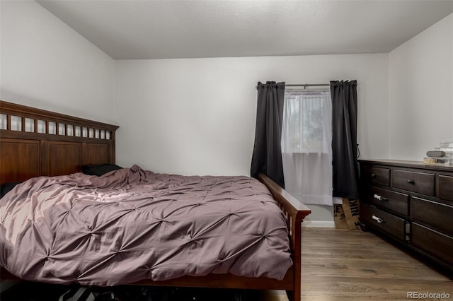 bedroom featuring light wood-type flooring