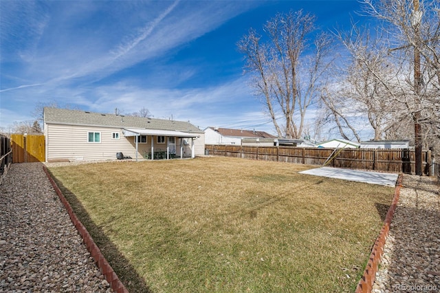 view of yard featuring a patio area and a fenced backyard