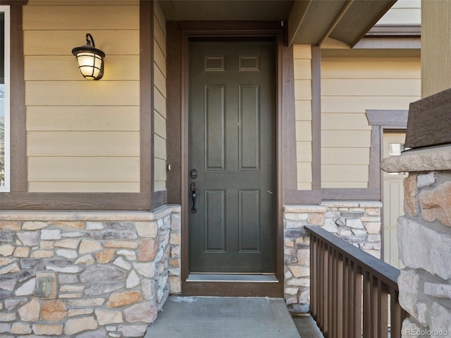 41 Garner Ln, Erie, CO 80516 - property entrance featuring stone siding and a porch