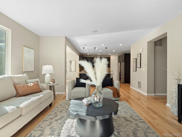 41 Garner Ln, Erie, CO 80516 - living area with baseboards, light wood-type flooring, and recessed lighting