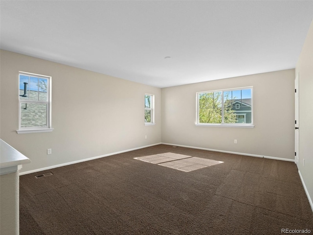 41 Garner Ln, Erie, CO 80516 - unfurnished room with baseboards and dark carpet