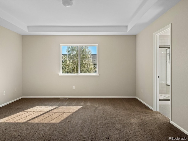 41 Garner Ln, Erie, CO 80516 - unfurnished room with carpet flooring, a tray ceiling, and baseboards