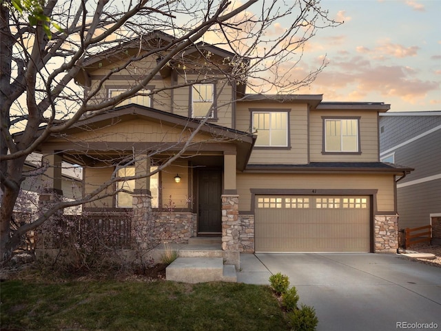 41 Garner Ln, Erie, CO 80516 - craftsman-style home featuring stone siding, a garage, and concrete driveway