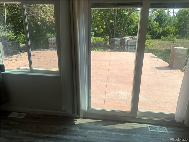 entryway featuring visible vents and wood finished floors