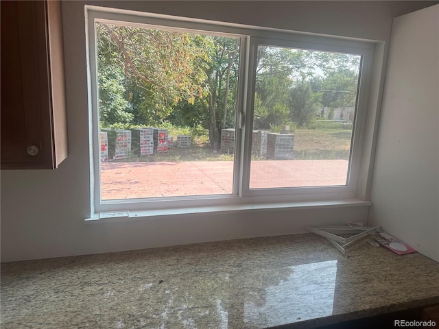 unfurnished room featuring plenty of natural light