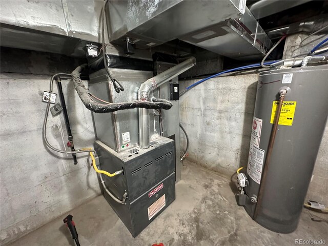 utility room featuring water heater