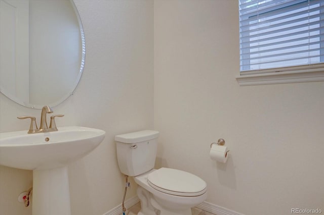 bathroom with toilet and sink