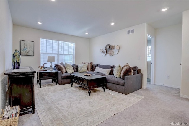 living room featuring light carpet