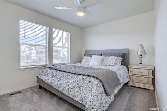 bedroom featuring ceiling fan and carpet