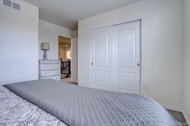 carpeted bedroom with a closet