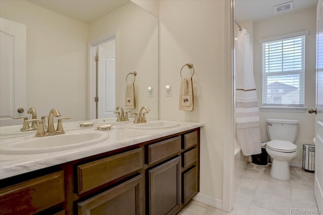 full bathroom with vanity, shower / tub combo, tile patterned floors, and toilet