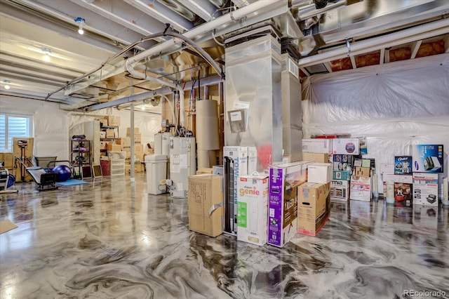 basement featuring heating unit and water heater