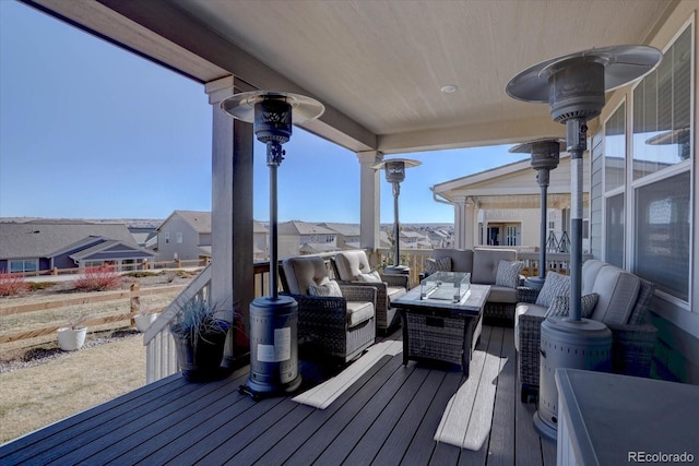 wooden terrace featuring outdoor lounge area