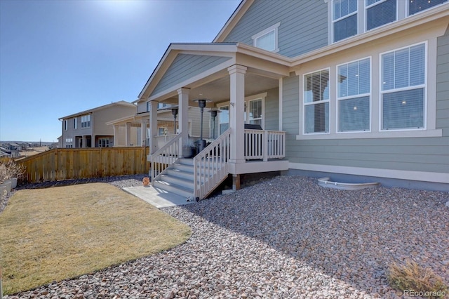 view of exterior entry featuring a porch