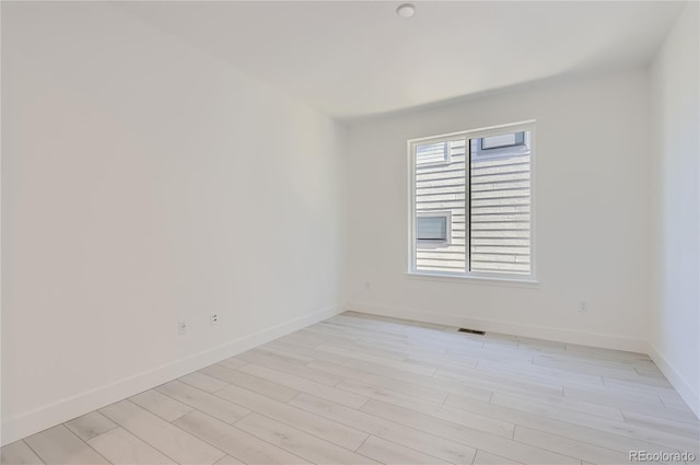 unfurnished room featuring light hardwood / wood-style flooring