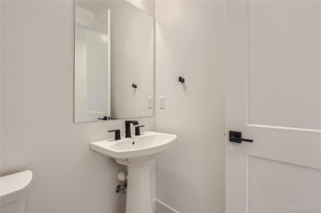 bathroom featuring toilet