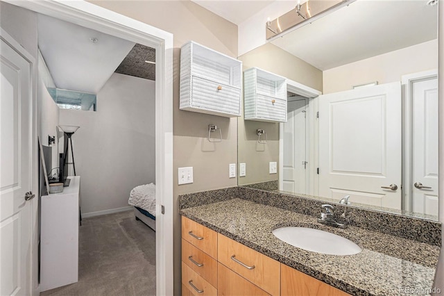 bathroom with baseboards and vanity