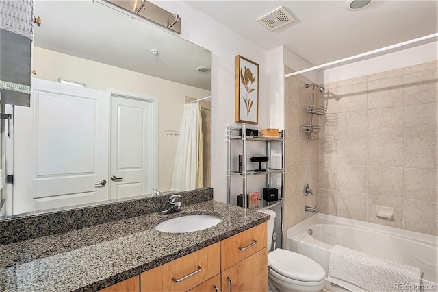 bathroom featuring vanity, toilet, shower / bathtub combination with curtain, and visible vents