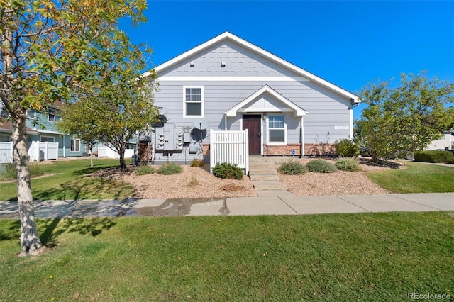 bungalow-style house featuring a front yard