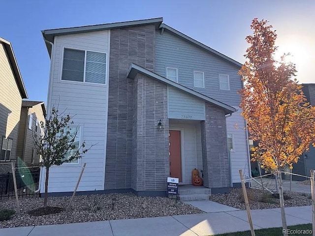 contemporary house with fence