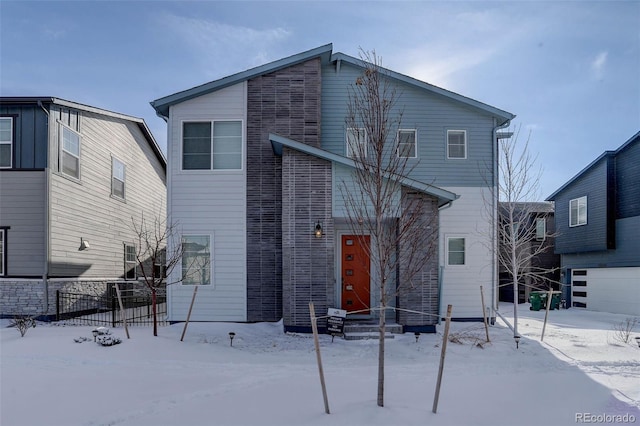 view of front of house featuring fence