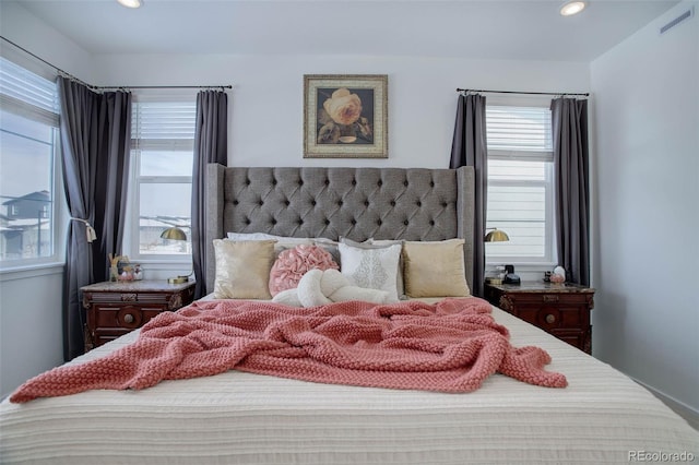 bedroom featuring multiple windows