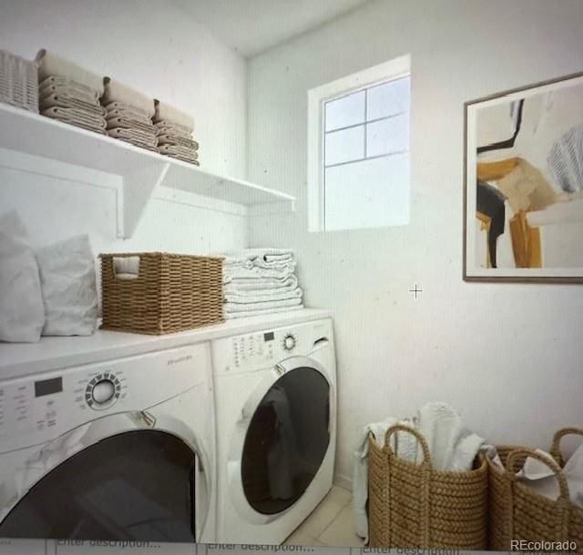 clothes washing area featuring separate washer and dryer