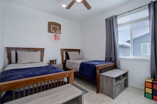 bedroom with ceiling fan and light colored carpet