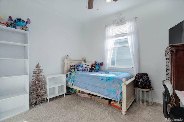 bedroom featuring ceiling fan and carpet