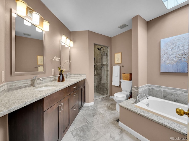 full bath with a skylight, visible vents, a sink, and a shower stall