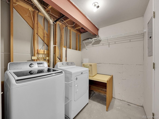 washroom with washing machine and dryer and laundry area