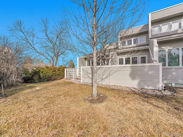 view of side of property featuring a yard