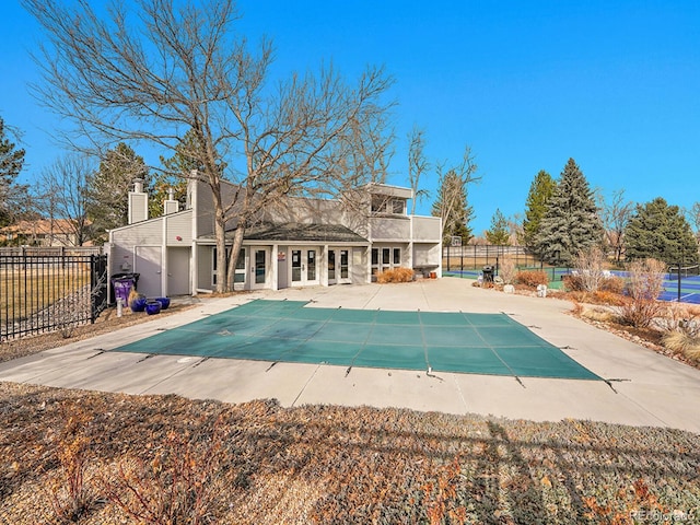 view of pool featuring a fenced in pool, french doors, a patio area, and fence