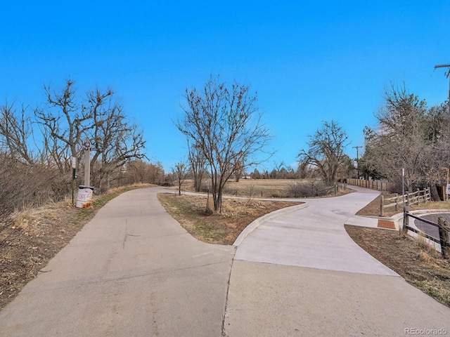 view of property's community with fence