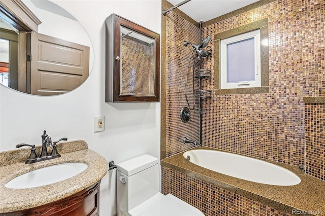 bathroom featuring shower / bathtub combination, vanity, and toilet