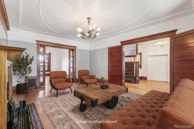 1451 N Gilpin St, Denver, CO 80218 - living area with a chandelier, hardwood / wood-style flooring, and stairway