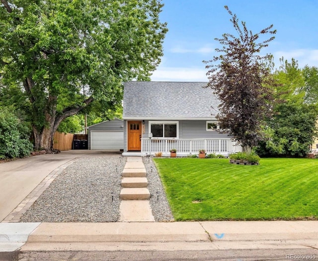 2535 S Julian St, Denver, CO 80219 - view of front facade featuring roof with shingles, covered porch, and a detached garage