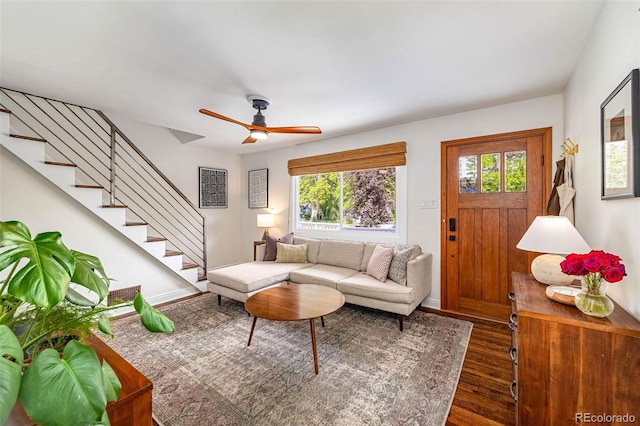 2535 S Julian St, Denver, CO 80219 - living area featuring dark wood-style floors, stairs, a ceiling fan, and baseboards