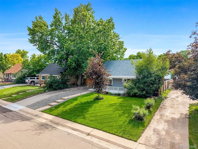 2535 S Julian St, Denver, CO 80219 - obstructed view of property with concrete driveway and roof with shingles