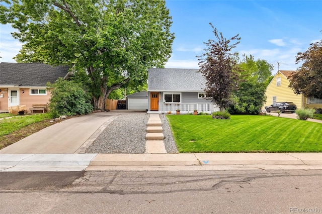 2535 S Julian St, Denver, CO 80219 - view of front of property featuring a front lawn, a porch, a shingled roof, and a garage