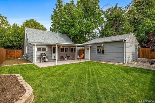 2535 S Julian St, Denver, CO 80219 - rear view of property with central air condition unit, a patio, and a shingled roof