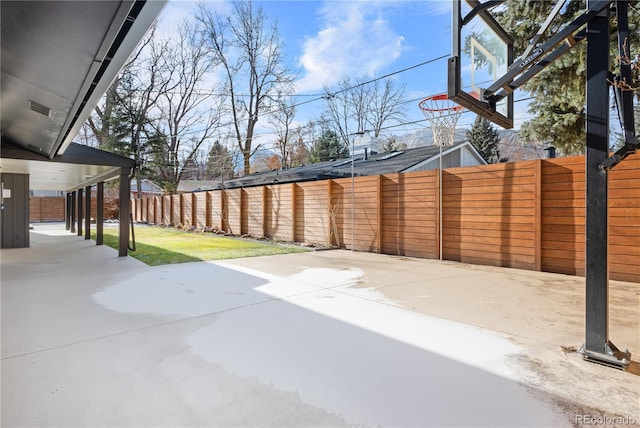 view of patio with basketball hoop