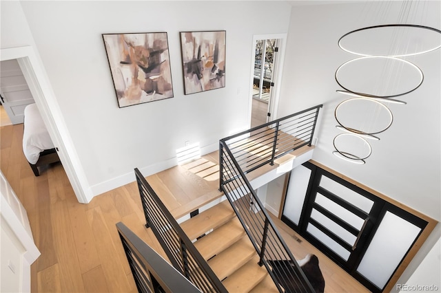 staircase featuring hardwood / wood-style flooring