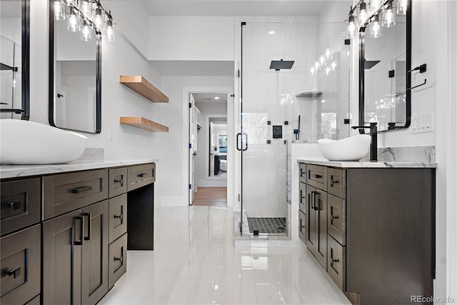 bathroom with vanity and an enclosed shower