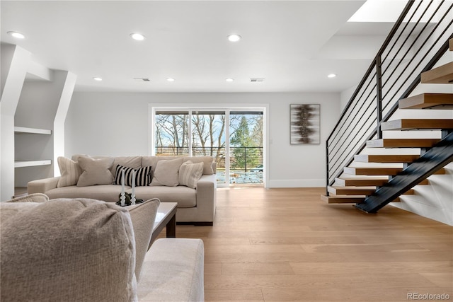 living room with light hardwood / wood-style floors