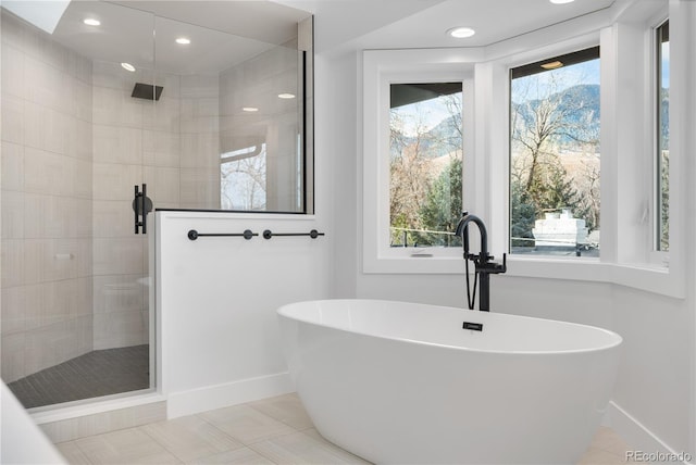 bathroom with tile patterned flooring and independent shower and bath